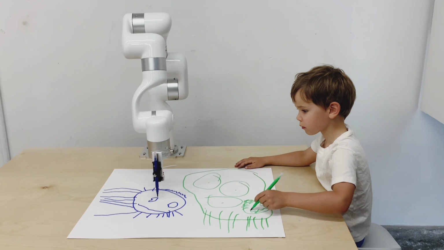 Child interacting with robot