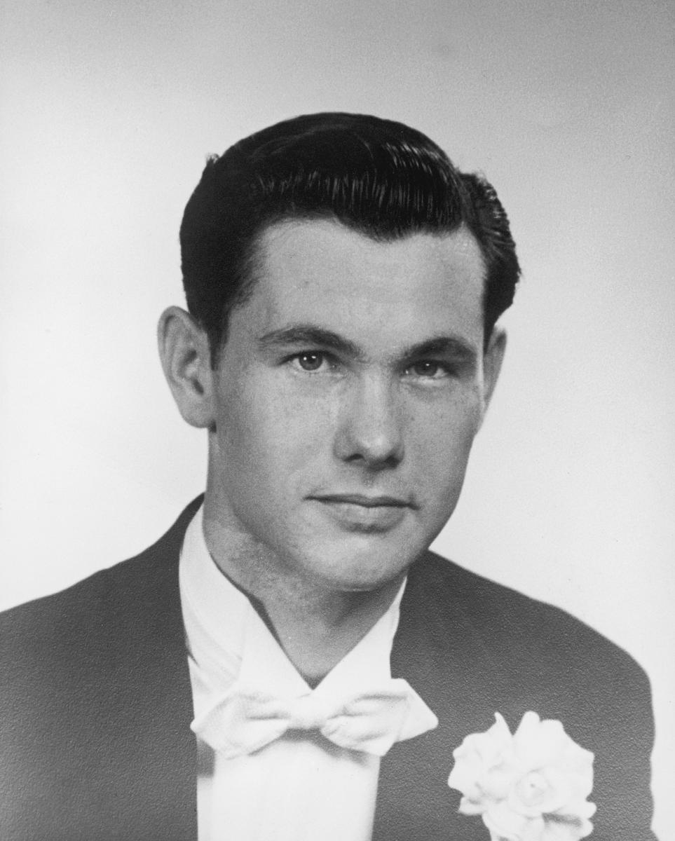 Johnny Carson posing with an owl