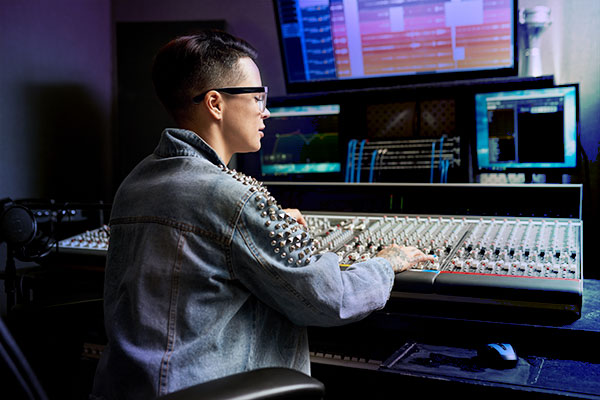 Person working with a mixer board