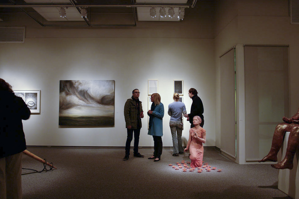 People view art at a gallery
