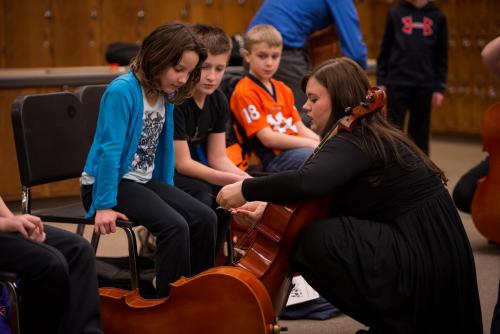 UNL student teaching cello at the UNL / LPS String Project