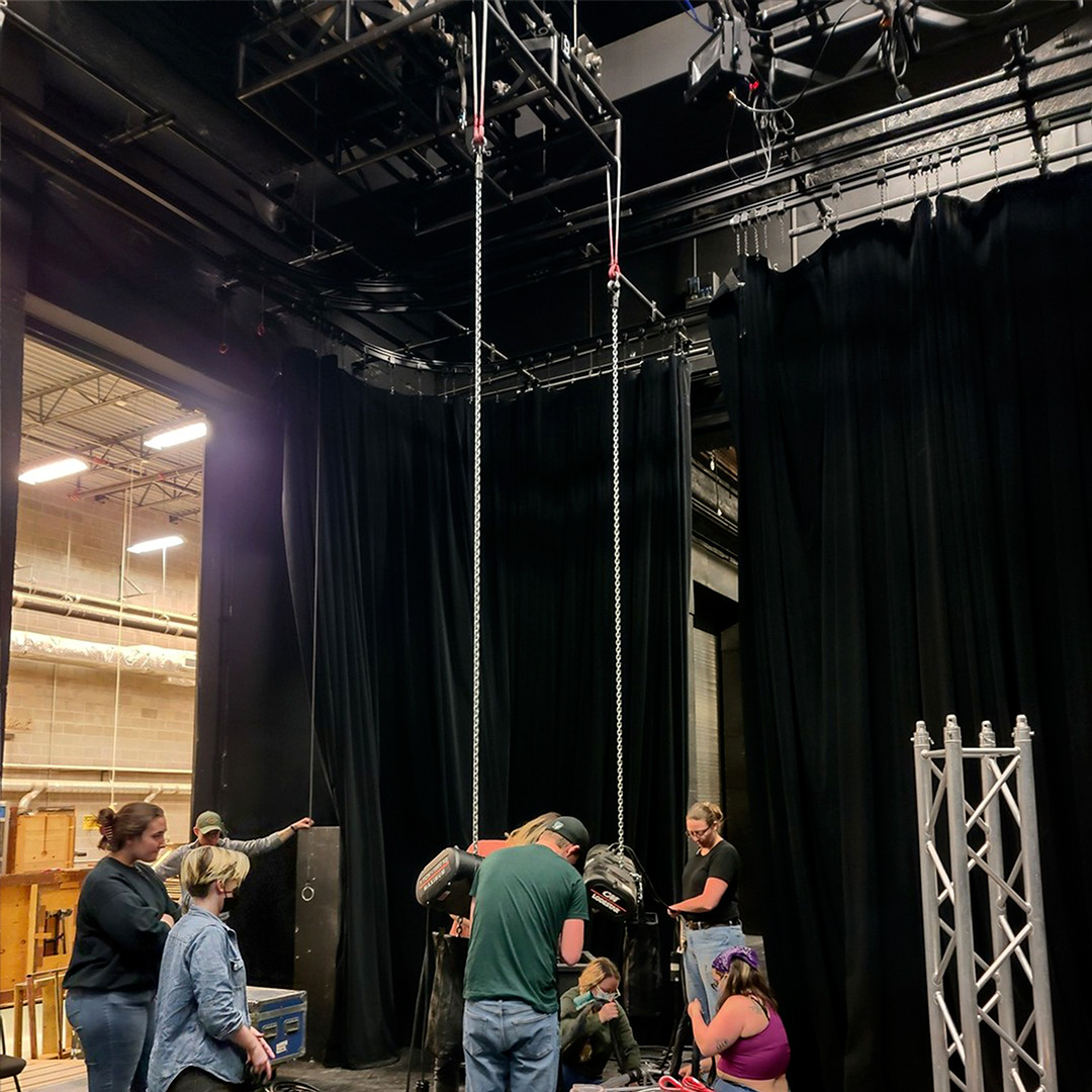 The Entertainment Rigging Class practicing rigging in class.