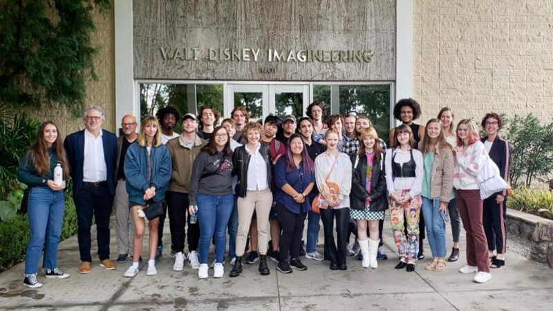 Group photo of students in front of studio