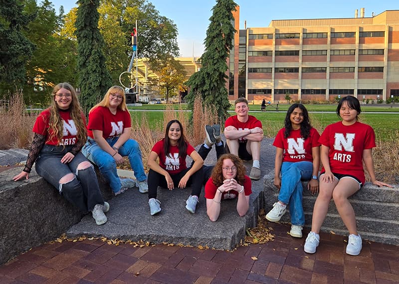 Students pose for a photo on UNL campus.