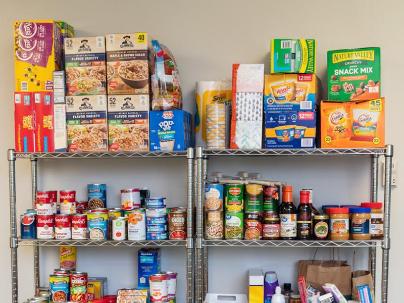 Wire pantry shelves full of dry goods.