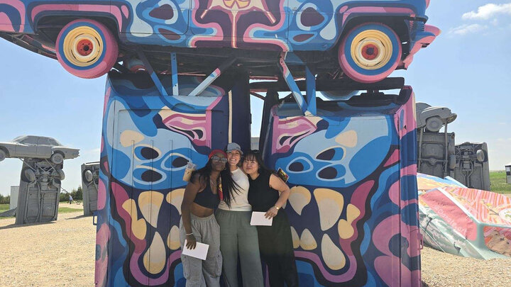 Left to right:  Michelle Reese, Kyren Gibson and Amy Xu at the Carhenge Mural Festival in Alliance, Nebraska. Courtesy photo.