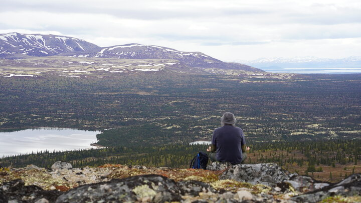 Trevor Frost meditates on the top of a mountain in Alaska. Courtesy photo.