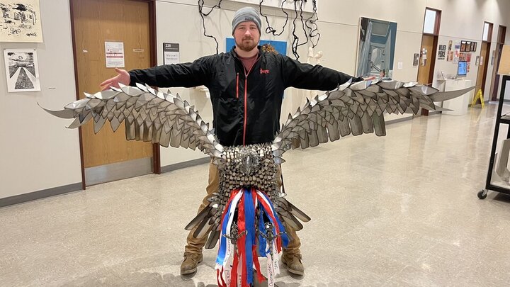 Luke Keilig, a 25-year-old Army veteran and junior art major, displays a piece he created, 