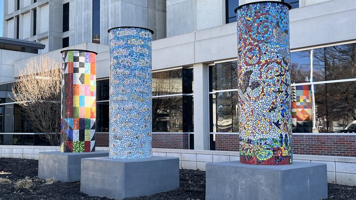 Three tile pillars at the entrance to Bryan West.