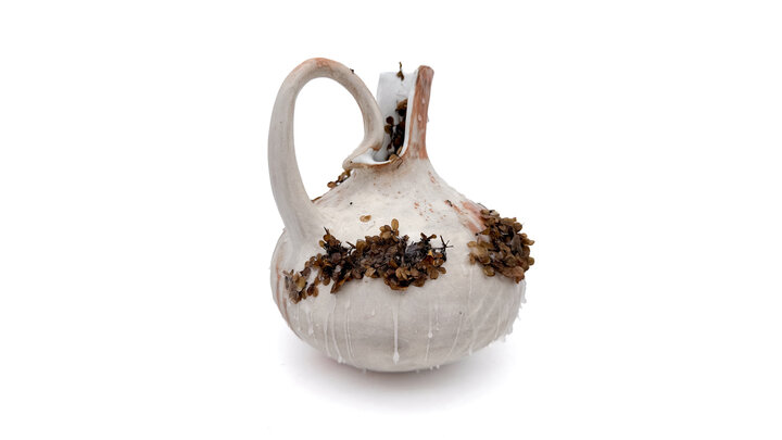 Marina Kushner, “reaching within,” ceramic, wax and found foliage, 2025.