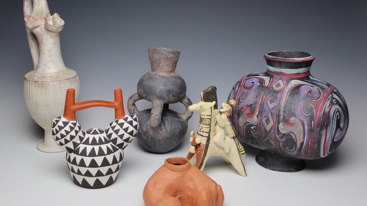 A grouping of objects from the exhibition, left to right:  Casey Beck, Etruscan Oinochoe; Sarah Rady, Nazca Achira Root Stirrup Vessel; Marina Kushner, Mangbetu Double Vessel; Sarah Rady, Thin Orangeware Dog Effigy Vessel from Teotihuacan, Mexico; Christopher Williams, Cypriot Terra Cotta Horse and Rider; and Charlotte Middleton, Han Dynasty Cocoon Vessel.