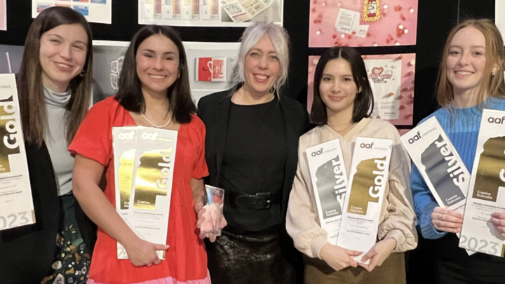 Professor Jen Landis poses with her graphic design students at the 2023 Creative Nebraska Awards Show. Courtesy photo.