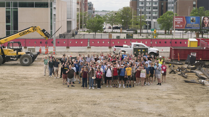 Students, faculty and staff in the Glenn Korff School of Music gathered for a group photo at the construction site for the new music building. Photo by Laura Cobb.