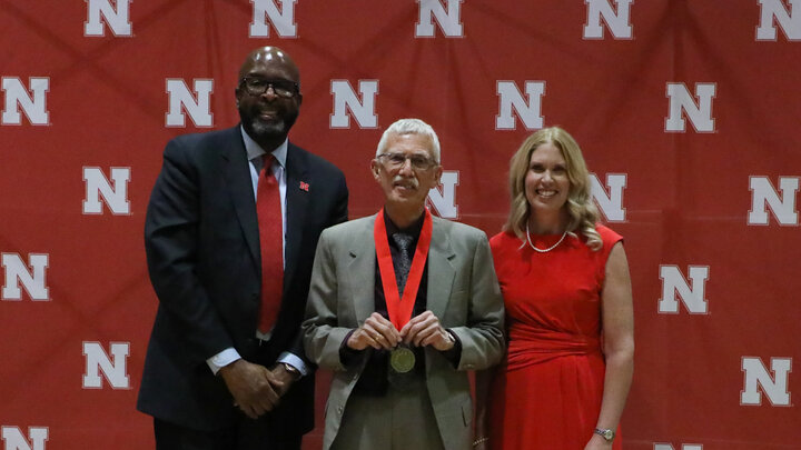 Donald Gorder (center) with UNL Chancellor Rodney Bennett and Nebraska Alumni Association Executive Director Shelley Zaborowski at the Medallion Dinner for Masters Week. Photo by Bailee Gunnerson.
