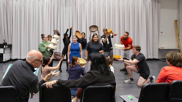 PHOTO CUTLINE: William Shomos (lower left) talks with Susan Ourada as the cast rehearses a scene from the UNL Opera “Hansel and Gretel.” Photo by Grace Worden. The opera will be performed Nov. 14-16 in Kimball Recital Hall.