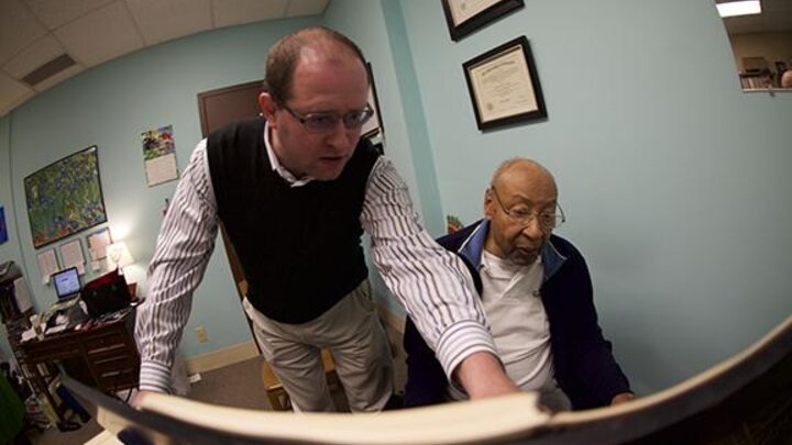Pianist Denis Plutalov asks a question of composer Robert Owens during Owens’ visit to UNL in March. Photo by Michael Reinmiller.