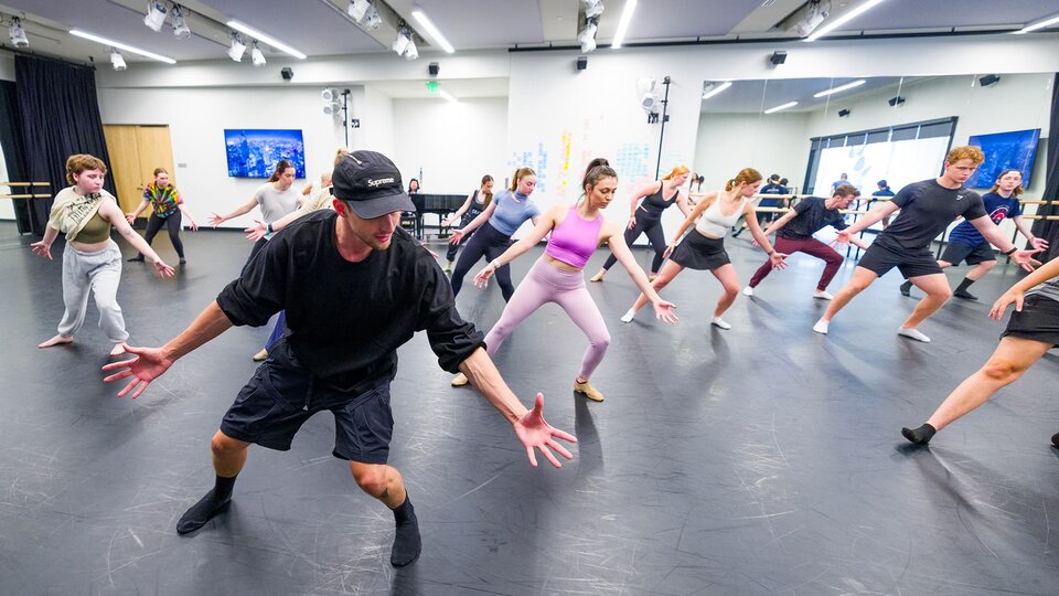 Dancers practice their moves.