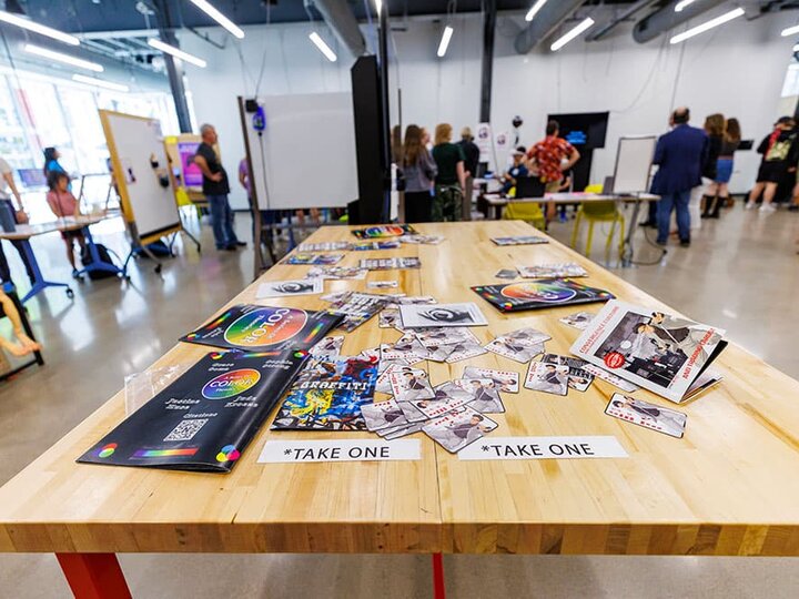A table covered with project pamphlets.