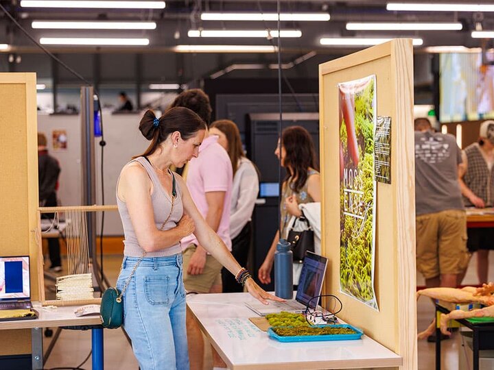 A woman interacts with a project at EMA's open studios.