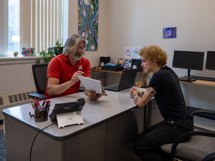 Sam Segrist with a student