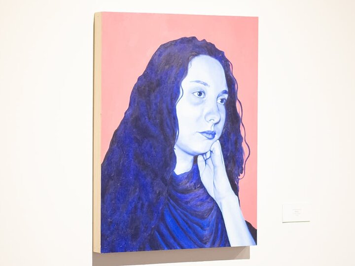 a portrait of a woman in blue