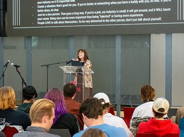 Michaela Wadzinski addresses audience members during a presentation.