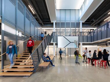 Students walk around the front hall of the Johnny Carson Center for Emerging Media Arts building.