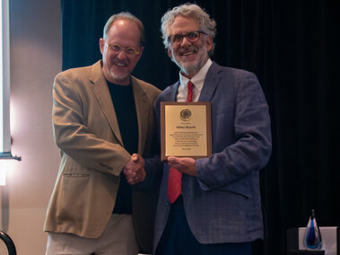 Hans Sturm’s retirement was recognized by Dean Andy Belser at Honors Day