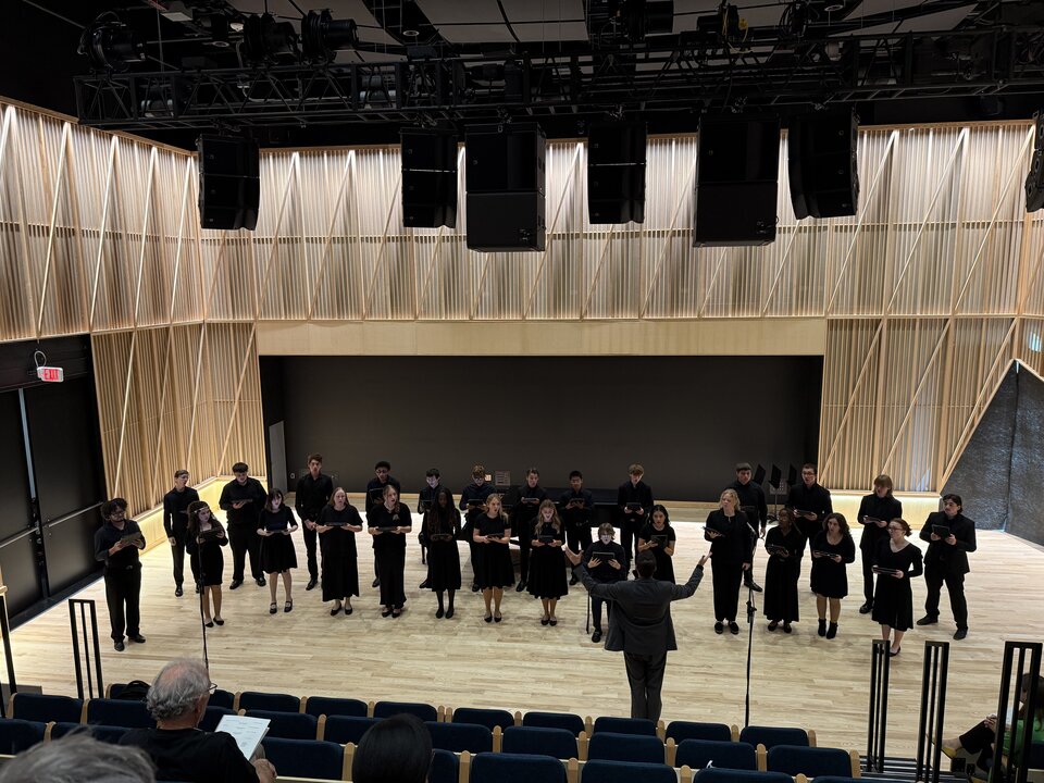 Choir performing in performance hall in Westbrook.