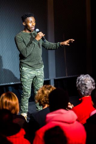 Jean-David Bizimana shares his story during the performance. Photo by Justin Mohling.