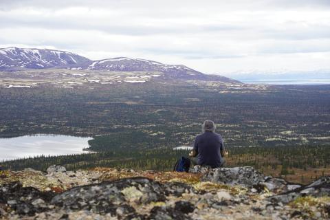 Trevor Frost meditates on the top of a mountain in Alaska. Courtesy photo.