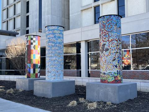 Three tile pillars at the entrance to Bryan West.