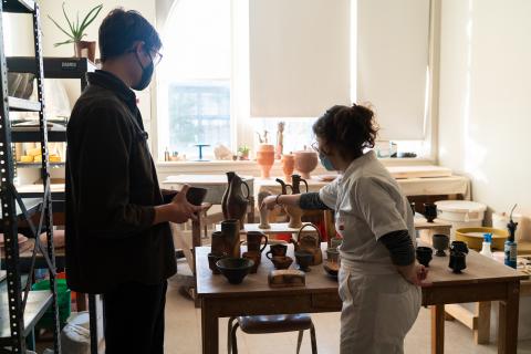 A visitor interacts with a graduate student at a previous Open Studios event. This year’s Open Studios event is Nov. 3. Photo by Eddy Aldana.
