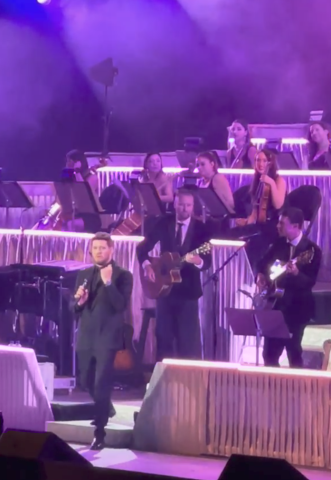 Andrea Alvarado Troncoso (2nd row from top, far right) on stage with Michael Bublé at his concerts in Mexico City in October. Courtesy photo.