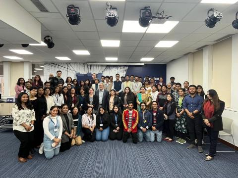 Andy Belser and Hank Stratton with students and faculty at the American Center in New Delhi.