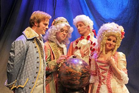 "Candide (Adam Fieldson), Dr. Pangloss (Sam Hartley), Maximilian (Nolan Henkle) and Cunegonde (Kendall Reimer) — students gathered around the globe with their teacher.