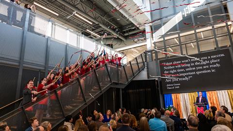 Carson Center students launch confetti from the stairs of the new facility during the Nov. 17 grand opening celebration. Photo by Justin Mohling. 