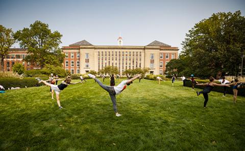 Students in a modern dance class led by Susan Ourada practice on the green space south of Love Library on Sept. 17. Support from donors has helped remove the university’s dance program from a list of proposed budget reductions. Photo by Craig Chandler, University Communication.