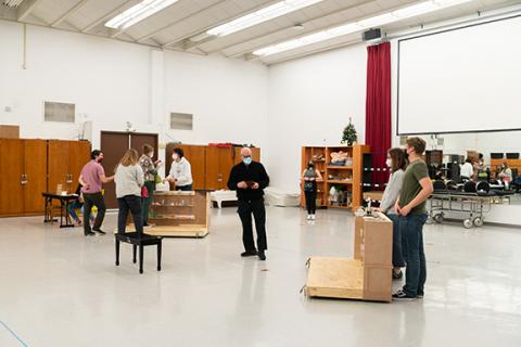 Larson Professor of Voice and Director of Opera William Shomos (center) as Mr. Maraczek during a rehearsal for “She Loves Me,” which will be performed March 4 and 6 Kimball Recital Hall. Photo by Eddy Aldana.