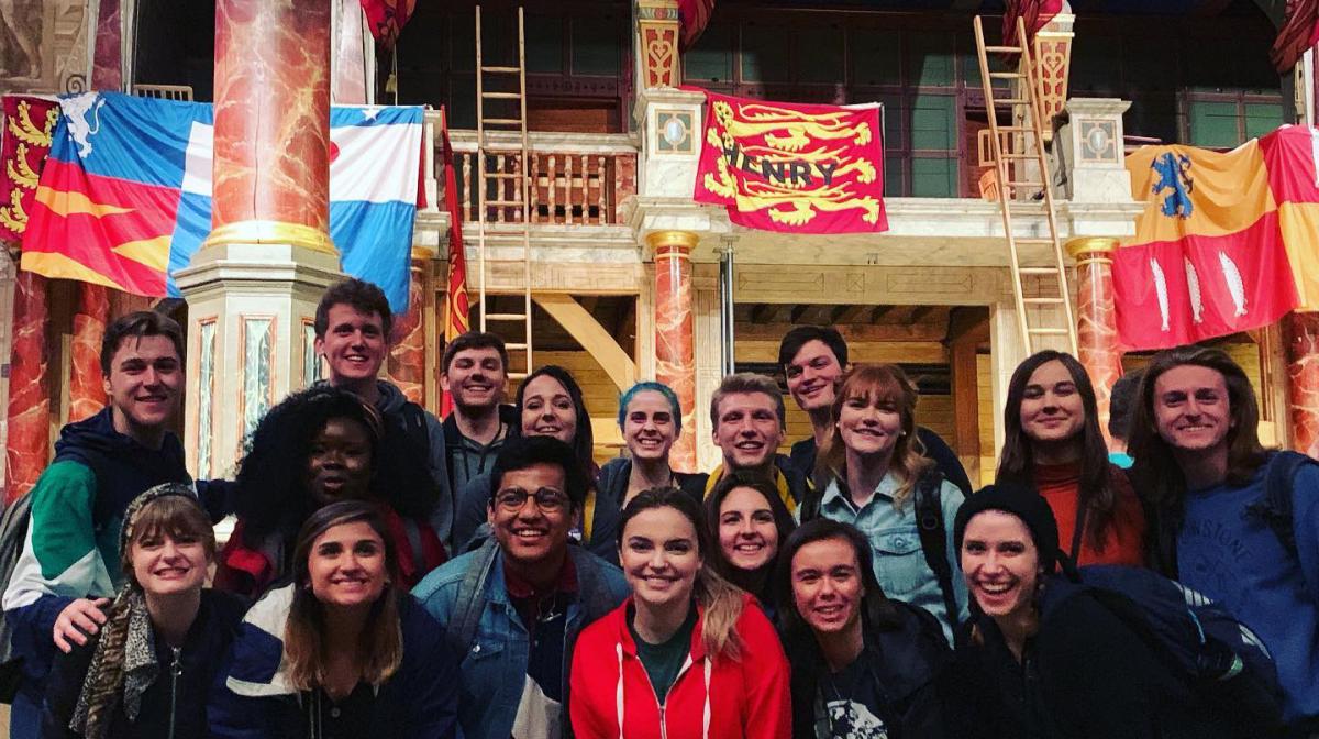 A group of Carson Center and Nebraska students posing for a group photo at Shakespeare's Globe Theatre in London while on a study abroad.