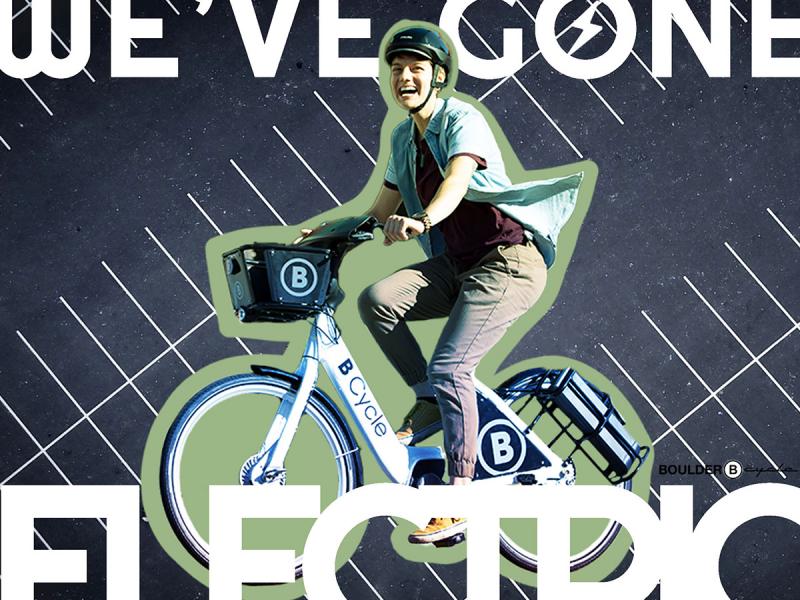 A cropped, detail of a design created for a Boulder, Colorado bike sharing program with a person riding a bicycle and stylized text reading 'We've Gone Electric.'