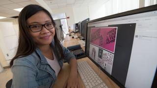 Emily working in the graphic design lab.