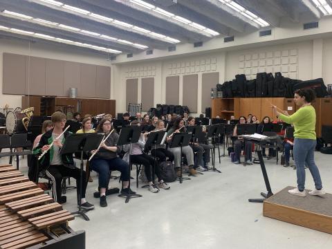 UNL Campus Bands rehearse with graduate assistant Foteini Angeli, a DMA in wind conducting candidate, conducting. Their May 5 concert will be live webcast only with no live audience. Courtesy photo.  
