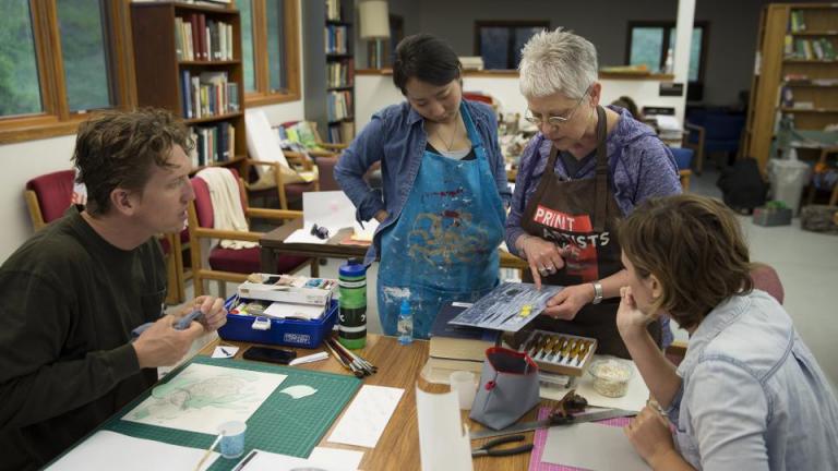 Karen Kunc, professor of art, discusses a printmaking techique with students enrolled in the Art at Cedar Point course. The new summer course is held at the UNL's Cedar Point Biological Station and allows students to focus solely on creating art for two weeks. Photo by Troy Fedderson.