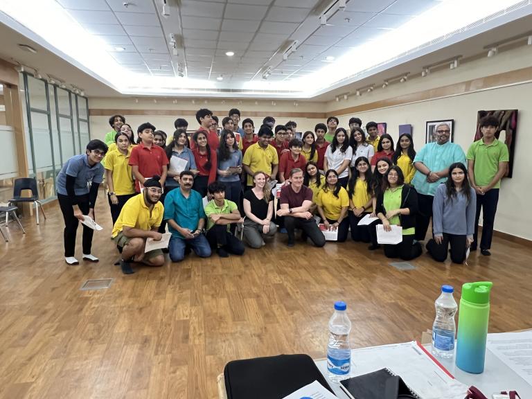 Ann Marie Pollard and Hank Stratton (front row, center) with students at Shri Ram School-Moulsari campus in New Delhi, India. Pollard and Stratton co-led a workshop for high school theatre students dramatizing Amanda Gorman’s “The Hill We Climb.”