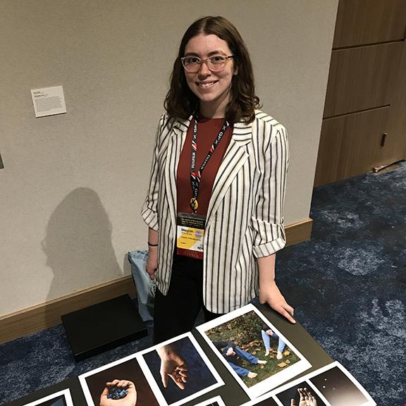 Megan Rhoades at her portfolio walkthrough table at the Society for Photographic Education Conference in March. 