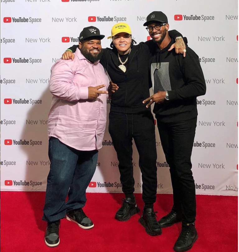 Orrin Wilson (left) and Anthony Barfield (right) with artist Young M.A. in 2019.