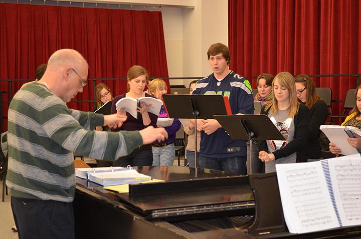 Hixson-Lied Professor William Shomos (left) directs a music rehearsal with the cast of "Cendrillon." Performances of the opera are Feb. 21 and 23 in Kimball Hall.