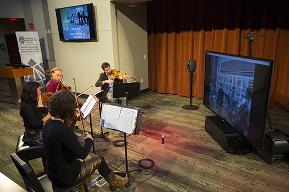 The Chiara String Quartet rehearses with the Avalon Quartet of Northern Illiniois University at Internet2 Day on Nov. 13. Photo by Craig Chandler.