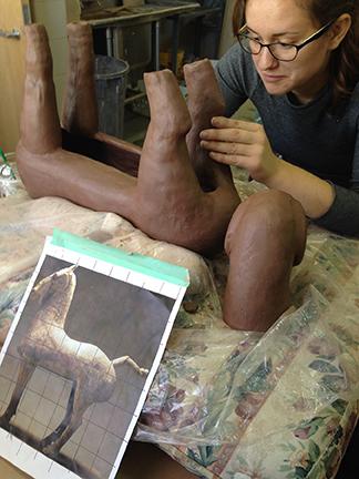 Junior Madelaine Healey re-makes a horse sculpture from the Han Dynasty China. Photo courtesy of Margaret Bohls. 
